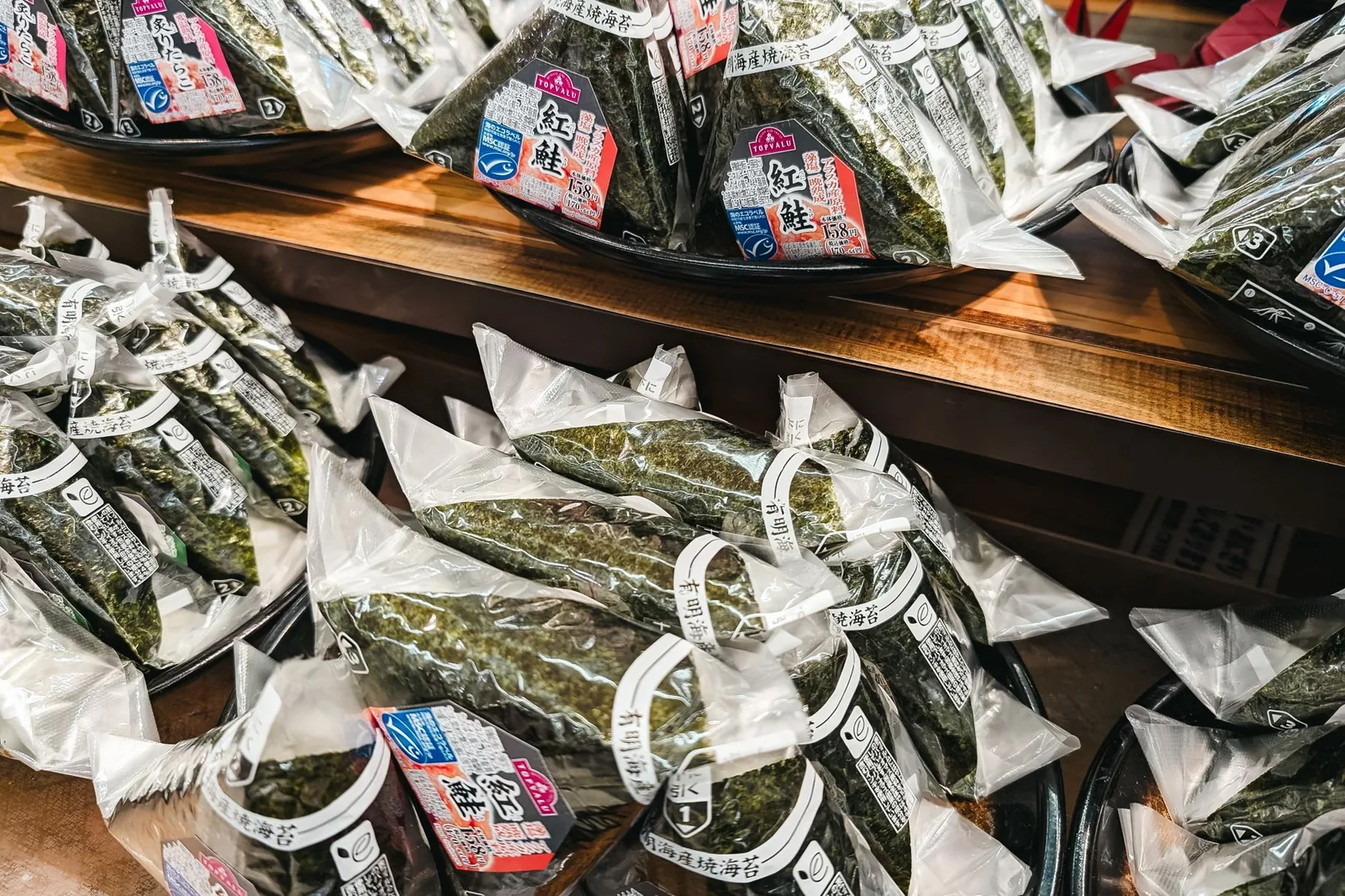 Japanese onigiri rice balls packaged for sale at a convenience store.